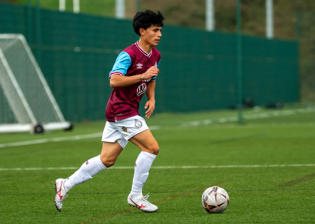 SSFC International Academy student training on grass pitch.